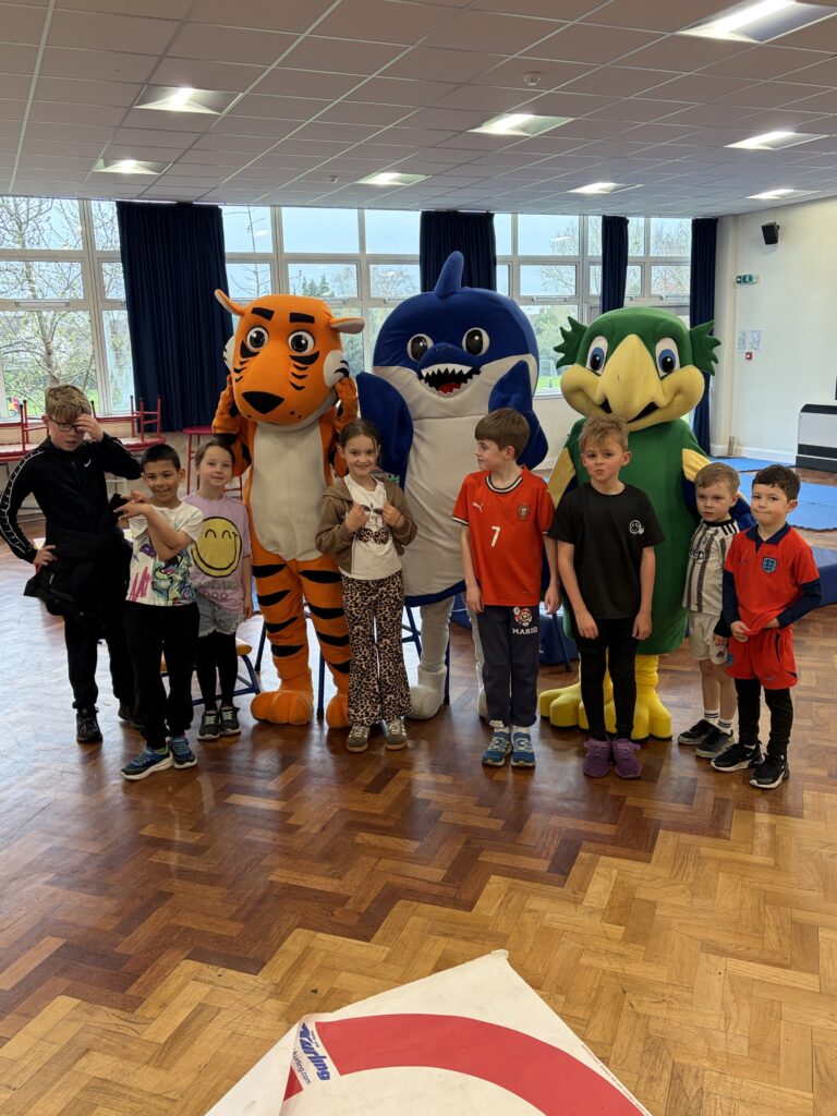 Sports Coaching Group's Easter holiday club at Holmes Chapel 2026. Here are the mascots.
